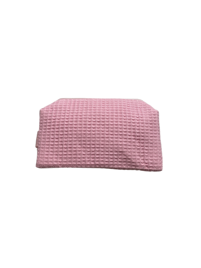 small pink monogrammed makeup bag