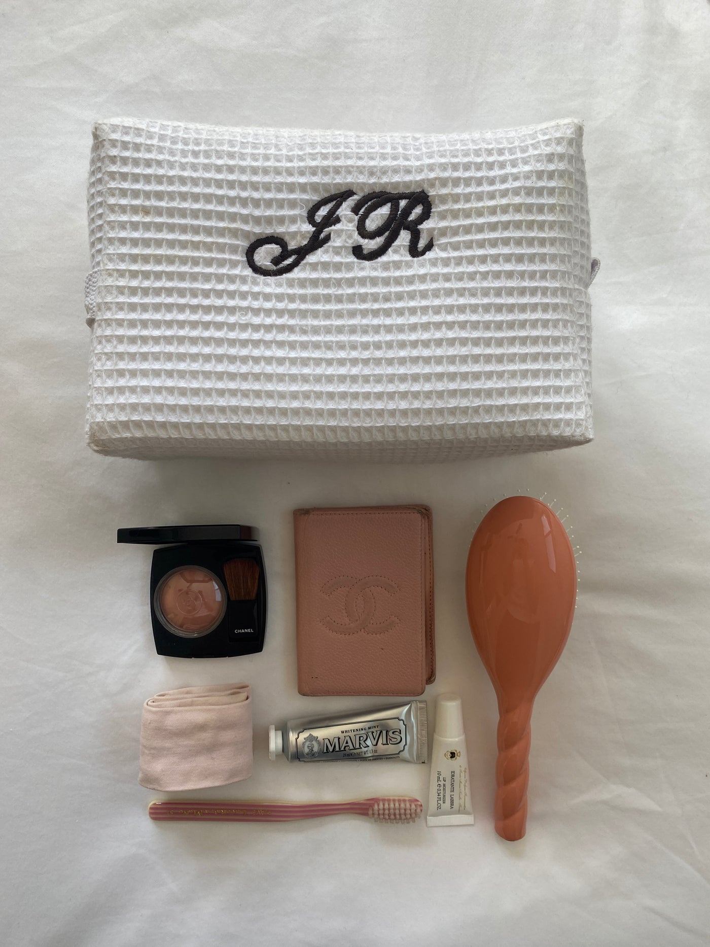 large white monogrammed makeup bag